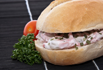 Rolls with meat salad decorated with parsley