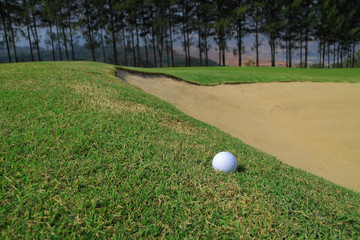 Golf ball and sand hole