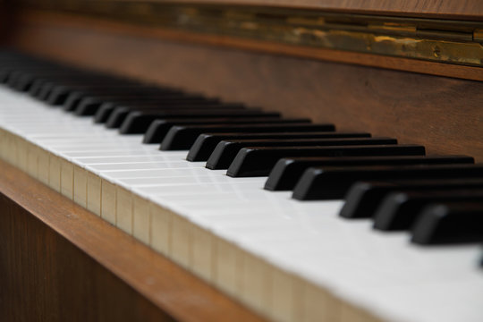 Closeup of antique piano keys.
