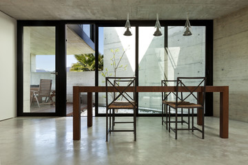 beautiful modern house in cement, interior, wooden dining table