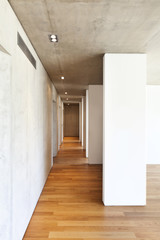 modern concrete house with hardwood floor,  corridor