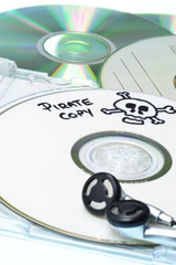 Music piracy with pirate copy cd and headphones
