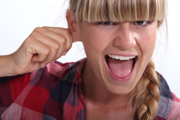 Woman pinching an ear