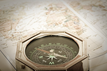 Fototapeta na wymiar compass close-up on map