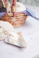 Fototapeta na wymiar Fresh organic bread and butter in basket