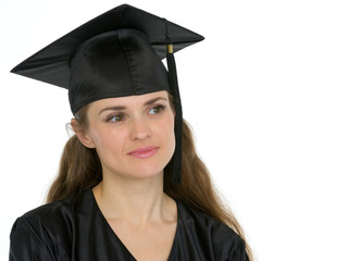 Portrait of thoughtful graduation woman looking on copy space