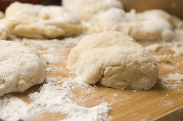 Dough on wooden board