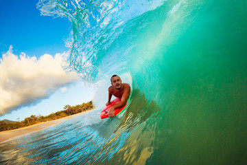 Boogie Boarder in the Barrel Riding Blue Ocean Wave in the Tube