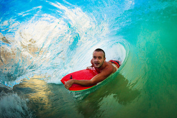 Boogie Boarder in the Barrel Riding Blue Ocean Wave in the Tube