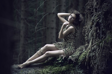 Eco girl lying on the trunk