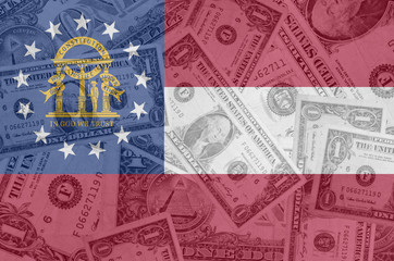 Fototapeta na wymiar US state of georgia flag with transparent dollar banknotes in ba
