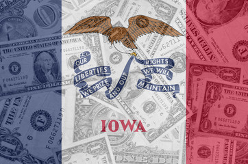 US state of iowa flag with transparent dollar banknotes in backg