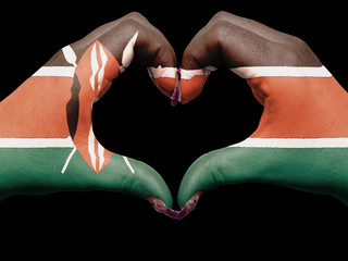 Heart and love gesture by hands colored in kenya flag  for touri