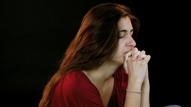 Girl praying intense