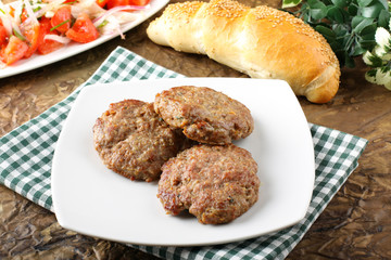 Meatballs served with inslata
