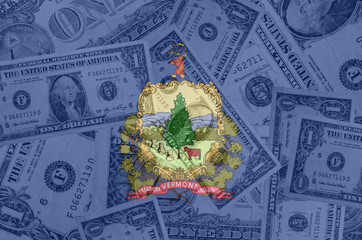 US state of vermont flag with transparent dollar banknotes in ba