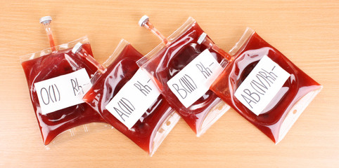 Bags of blood on wooden background