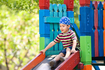 boy  playing on slide