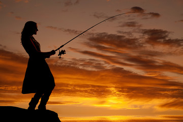 Woman sunset fishing