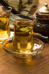 Cup of turkish tea and hookah served in traditional style