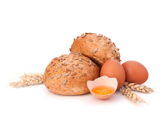 Bun with seeds and broken egg