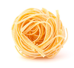 Italian pasta tagliatelle nest isolated on white background