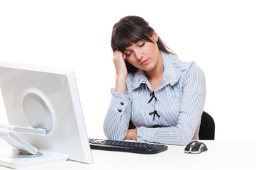 studio shot of young woman sleeping on her workplace