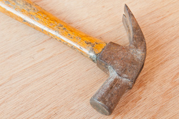 old hammer on wood background