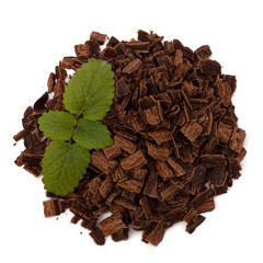 Crushed chocolate shavings pile and mint leaf