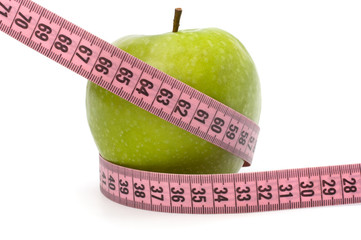 Apple with tape measure. Healthy lifestyle concept.