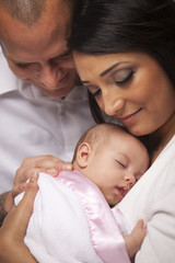Fototapeta na wymiar Mixed Race Young Family with Newborn Baby