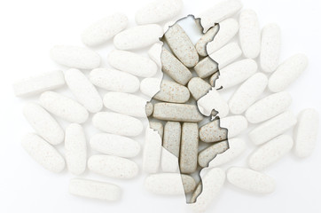 Outline map of tunisia with pills in the background for health a