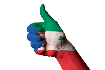 Obraz na płótnie Canvas equatorial guinea national flag thumb up gesture for excellence