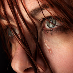 beauty girl cry on black background