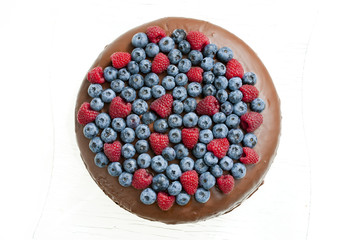chocolate cake with raspberries and blueberries