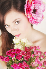 natural beauty portrait woman with flower in the hands