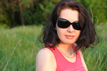 beautiful girl on a green meadow