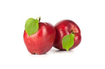 Ripe red apple with a leaf