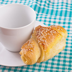 Breakfast with coffee and croissants