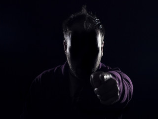 Man Pointing with his finger Black Background