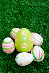 Fototapeta na wymiar Easter eggs on grass - Bottom