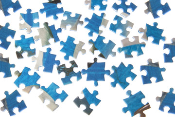 Puzzles dispersed on a white background.