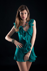 Fototapeta premium Portrait of beautiful girl with green dress.