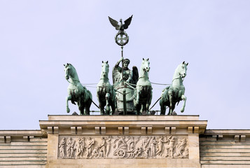 Quadriga Monument Over Brandenbourg Gate in Berlin (Germany), with in the foreground, the star of a Berlin's typical street lamp, oblique view. © gio_cala
