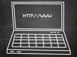 laptop on blackboard with web address