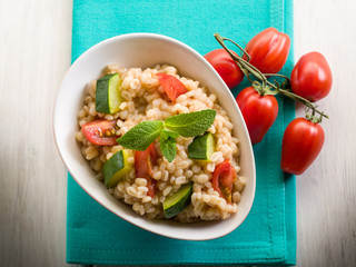 barley risotto with zucchinis and fresh tomatoes