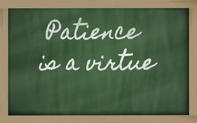 Obraz premium expression - Patience is a virtue - written on a school blackbo