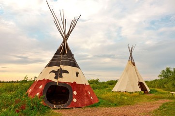 image of an aboriginal tee-pee at sunset in the summer