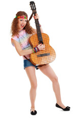 woman in hippie outfit playing on guitar
