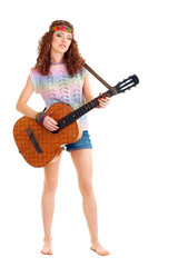 woman in hippie outfit playing on guitar